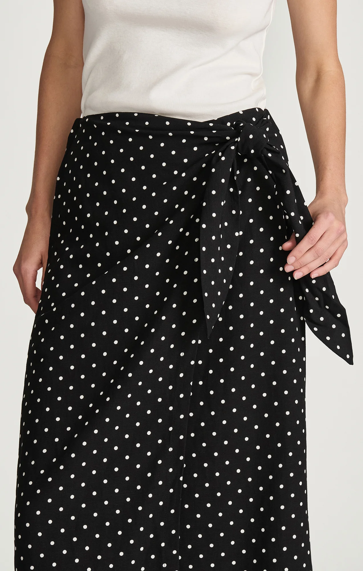 WOVEN WRAP MIDI SKIRT IN BLACK POLKA DOT PRINTED - Image 4